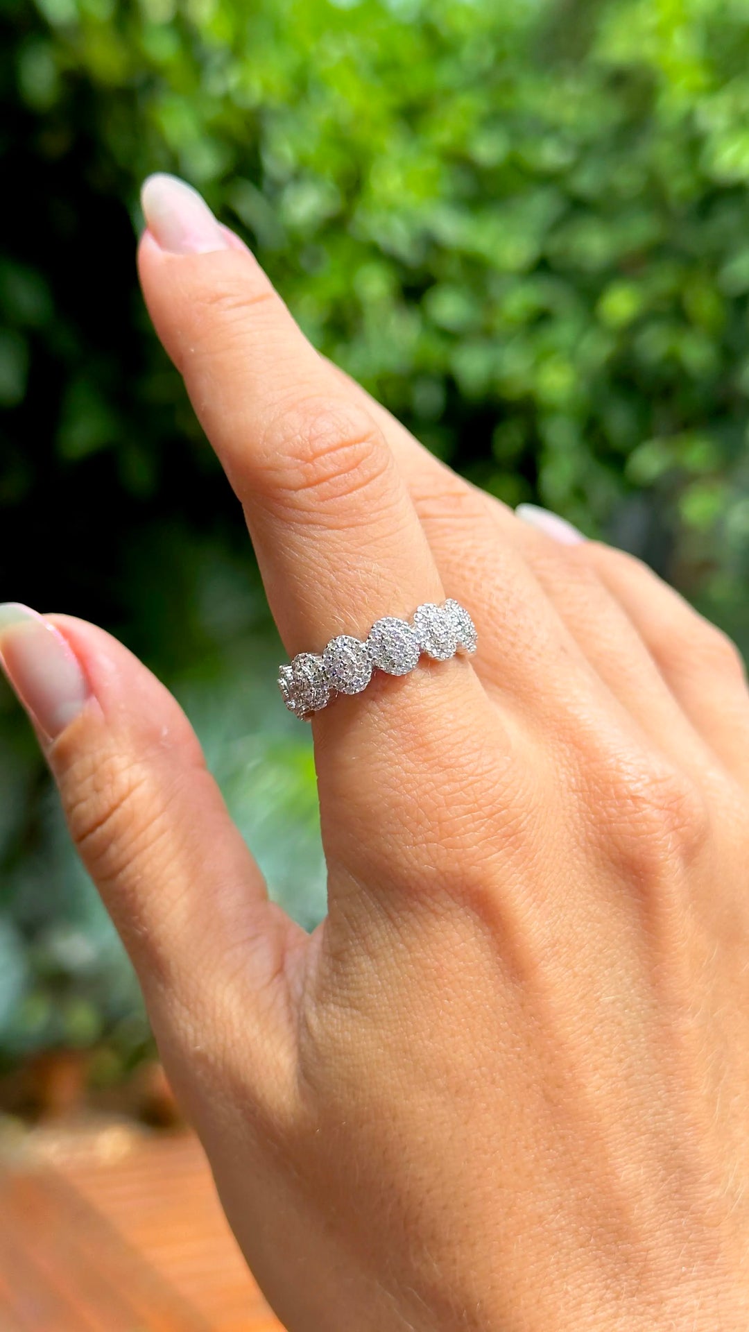 Woman wears Oval Band Ring with white cubic zirconia rhodium plated Elladora Store Australia