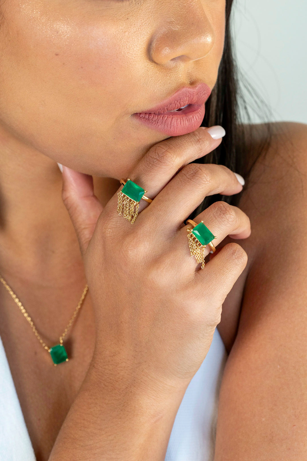 Woman wears rectangular emerald fusion fringe ring 18k gold filled Elladora Store Australia