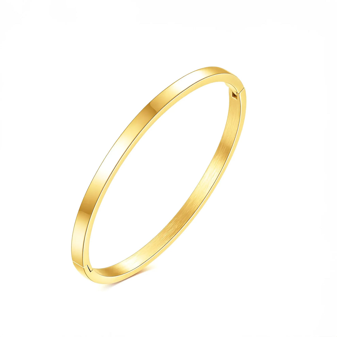 A gold-plated stainless steel bangle bracelet with a polished finish.