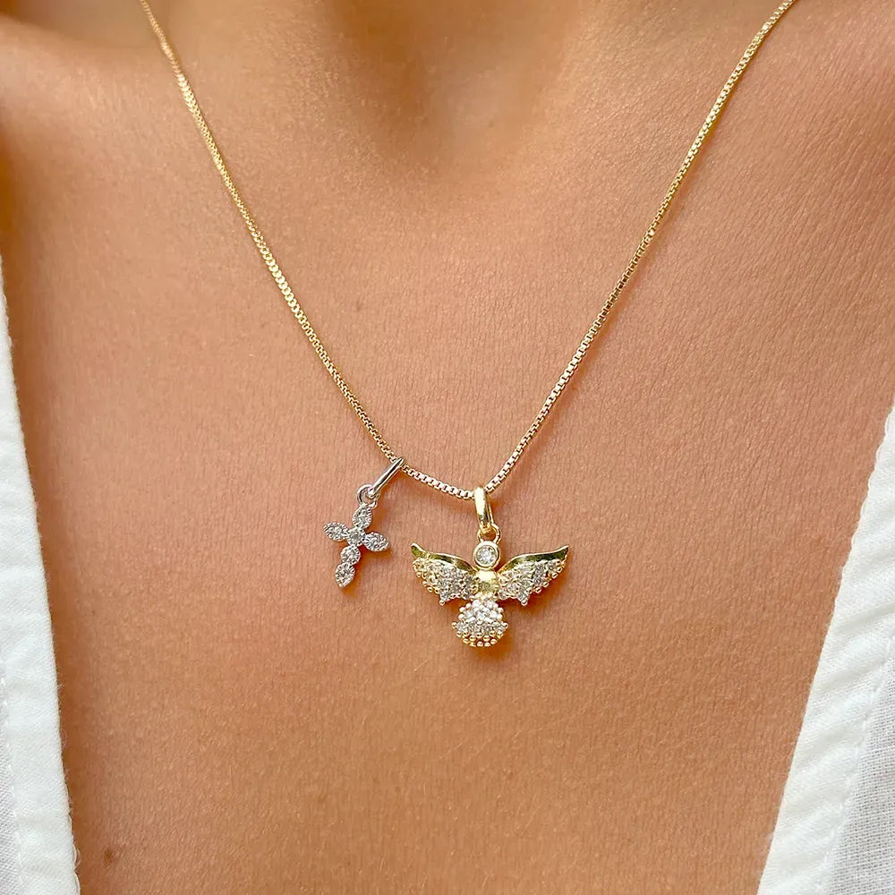 Woman wears Angel & Cross Necklace with white cubic zirconia, 18k Gold Plated, Elladora Store Australia