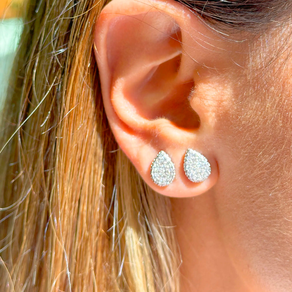 Woman wears bright drop with white cubic zirconia stud earrings 925 Sterling Silver Elladora Store Australia 