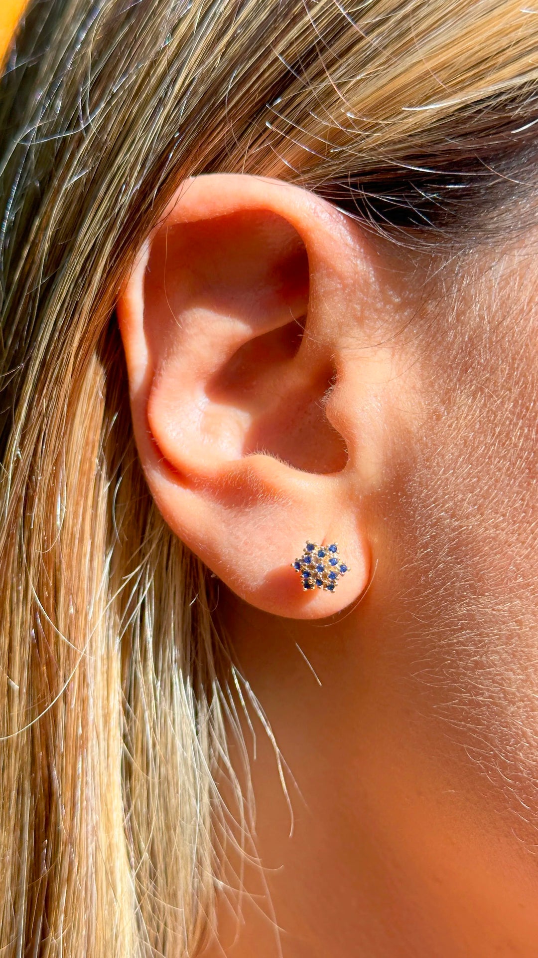 Woman wear Bright flake dark blue cubic zirconia stud earrings 18k gold filled on copper Elladora Store Australia