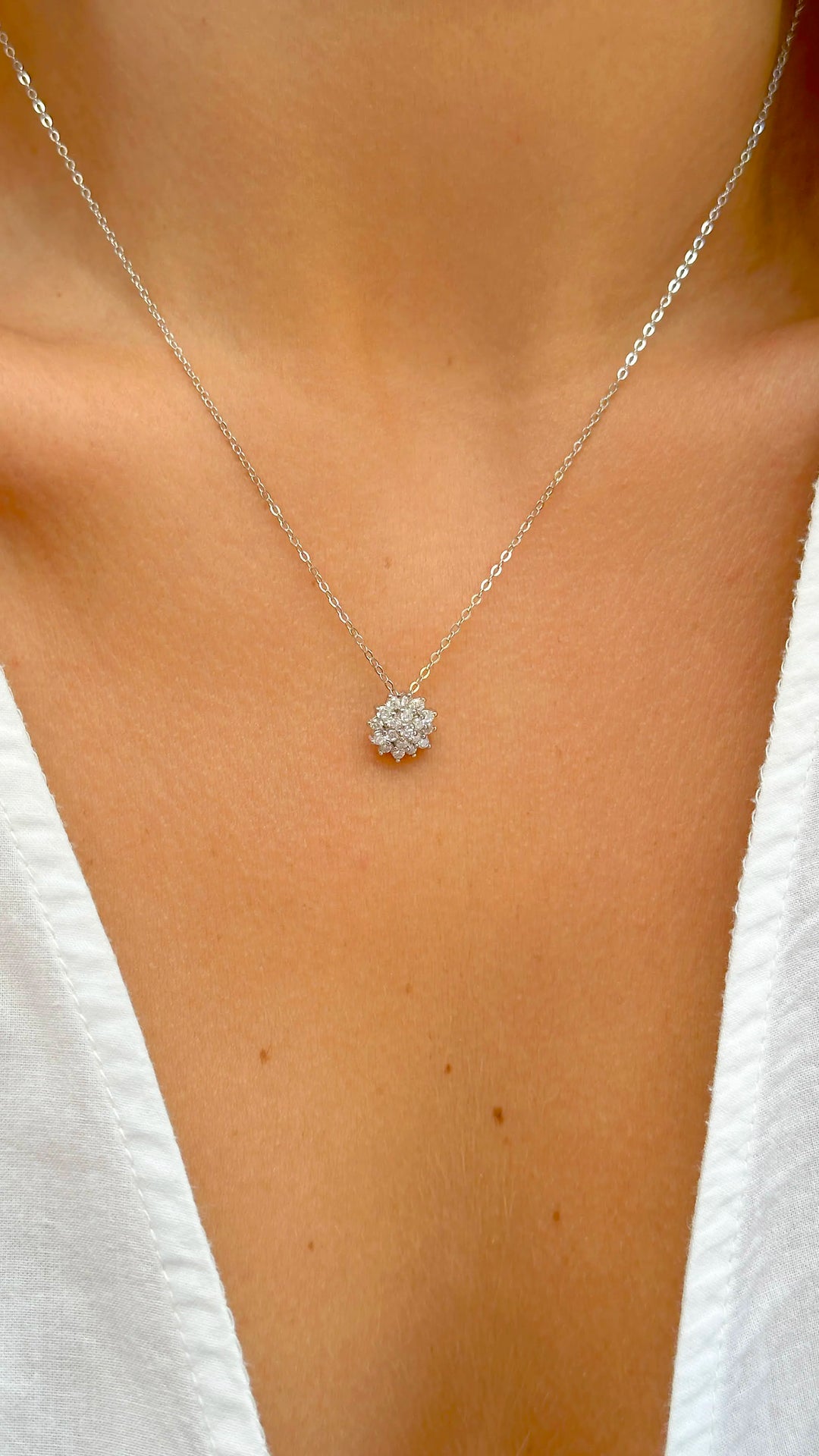 Woman wears bright flake with white cubic zirconia pendante necklace 925 Sterling Silver Elladora Store Australia 