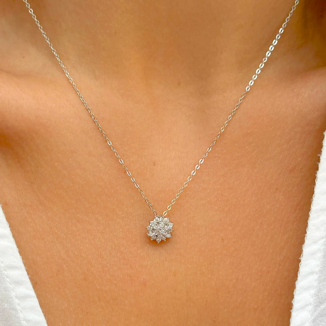 Woman wears bright flake with white cubic zirconia pendante necklace 925 Sterling Silver Elladora Store Australia 