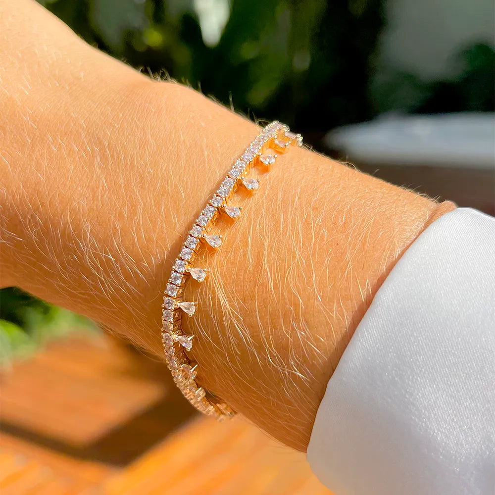 Woman wears Raindrop bracelet with white cubic zirconia 18k Gold Plated Elladora Store Australia