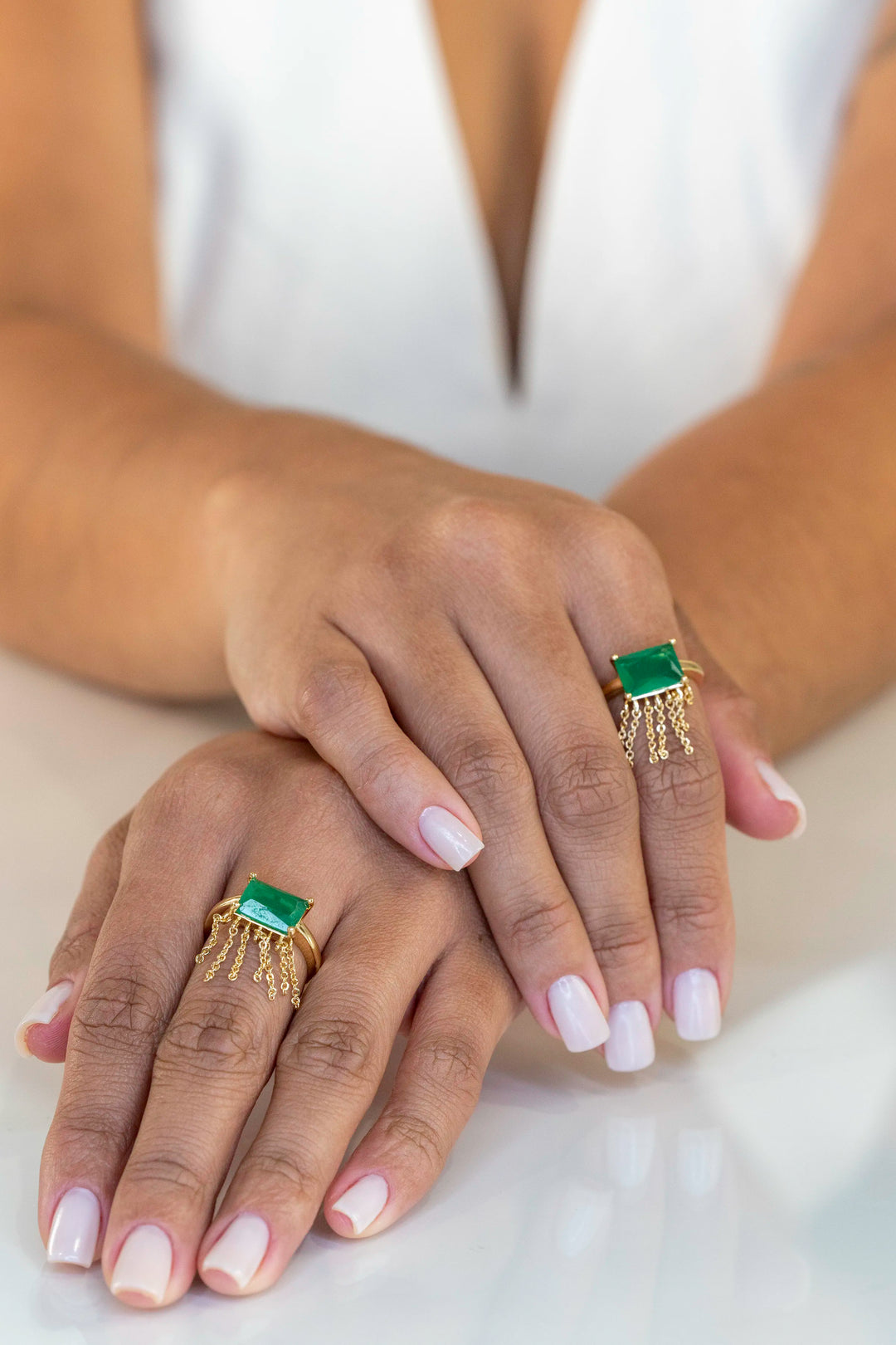 Woman wears rectangular emerald fusion fringe ring 18k gold filled Elladora Store Australia