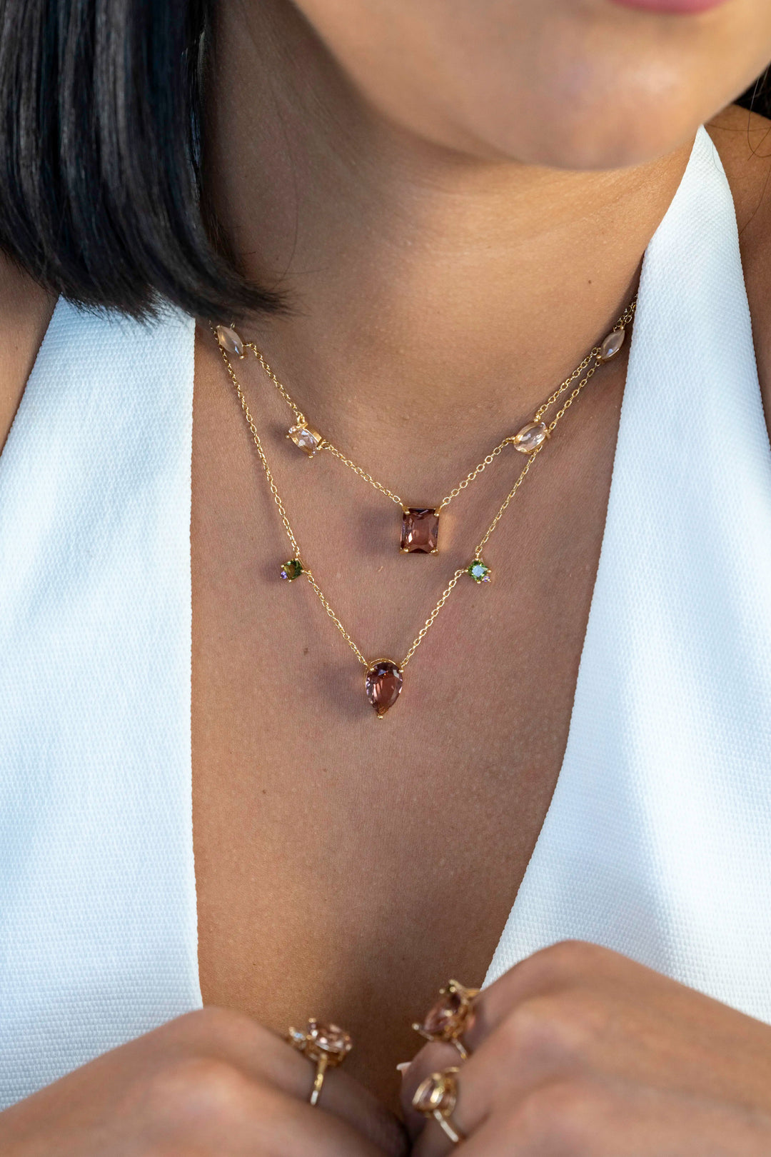 Woman wears Rhodolite, morganite and quartz crystals shapes necklace 18k gold filled Elladora Store Australia