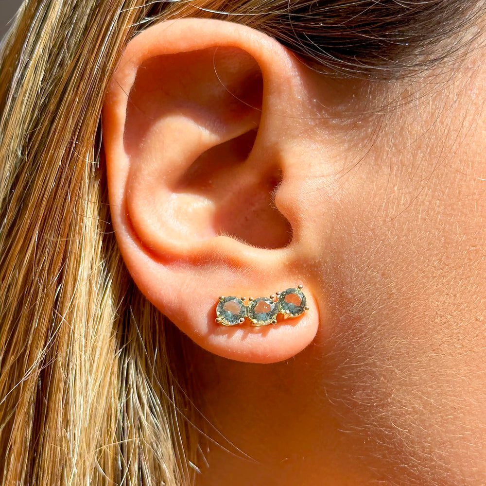 Woman wears Bright Round Blue Topaz Crystal Ear Cuff Earrings, 18k Gold Filled Elladora Store Australia