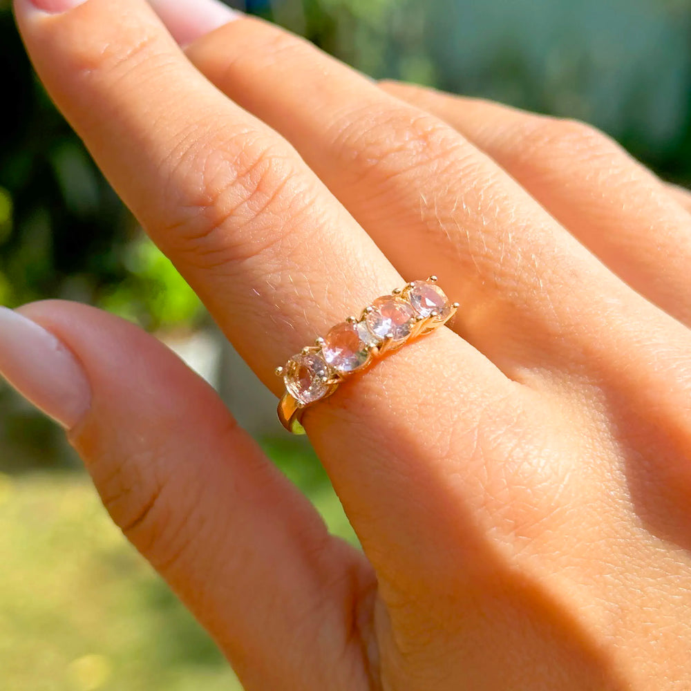 Woman wears Bright Round Rhodolite Crystal Band Ring, 18k Gold Filled Elladora Store Australia