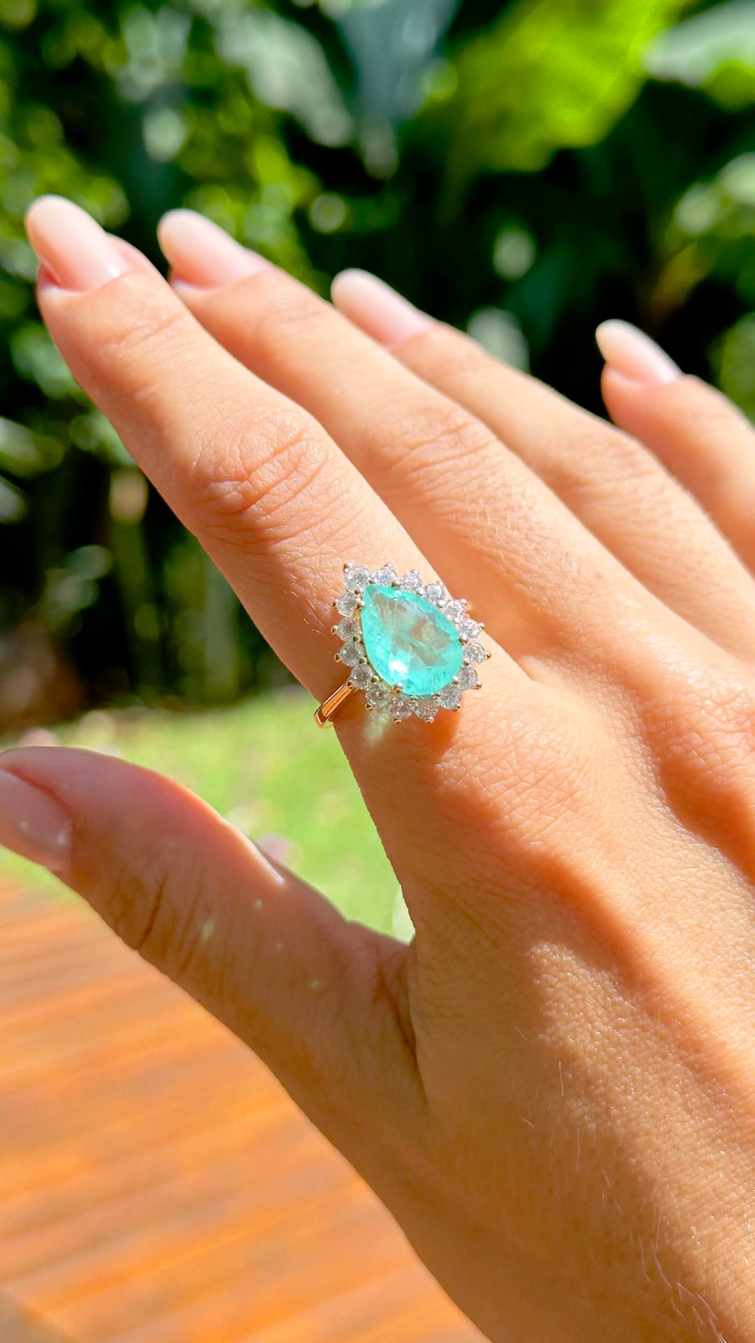 Woman wears Teardrop Colombian Emerald Fusion with white zirconia Elladora Store Australia