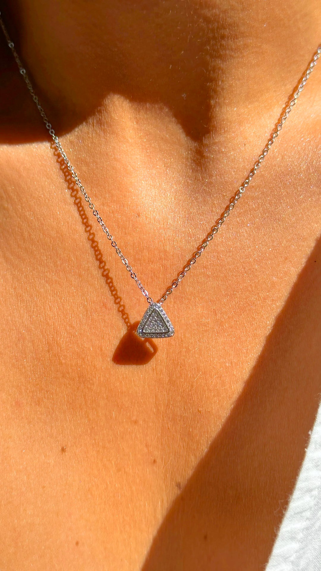 Woman wears Bright Triangle with white Cubic Zirconia Pendant Necklace, 925 Sterling Silver Elladora Store Australia