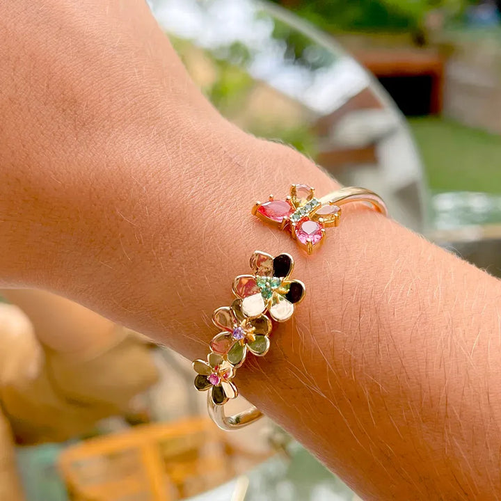 Woman wears Butterfly & Flowers, Pink Tourmaline, Citrine, Smokey Topaz Crystal & Emerald, Amethyst Zirconia Cuff Bracelet, 18k Gold Filled Elladora Store Australia