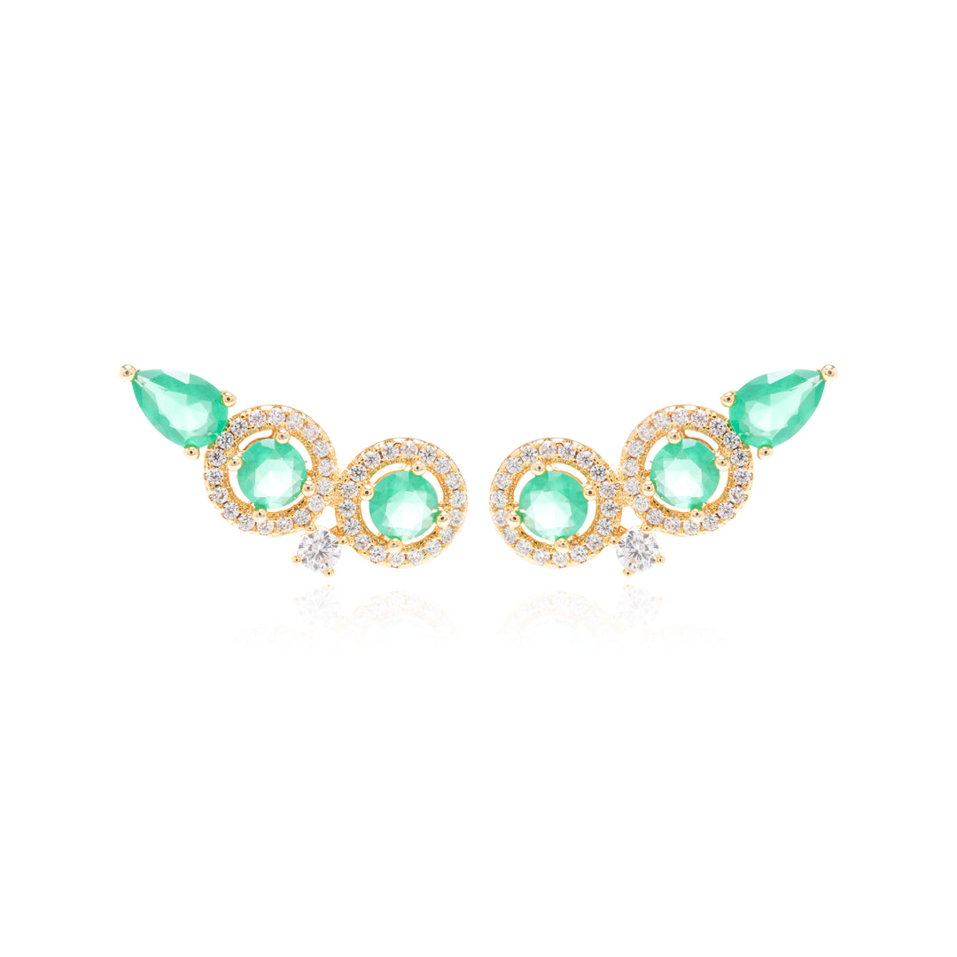 A pair of gold-toned statement earrings featuring three round light green gemstones and two teardrop-shaped green gemstones, accented with small clear stones, shown on a white background.