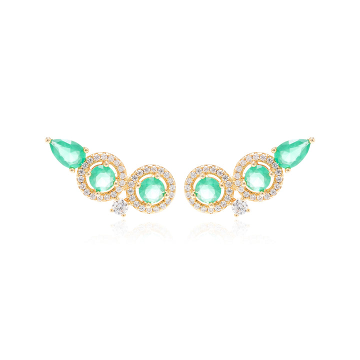 A pair of gold-toned statement earrings featuring three round light green gemstones and two teardrop-shaped green gemstones, accented with small clear stones, shown on a white background.