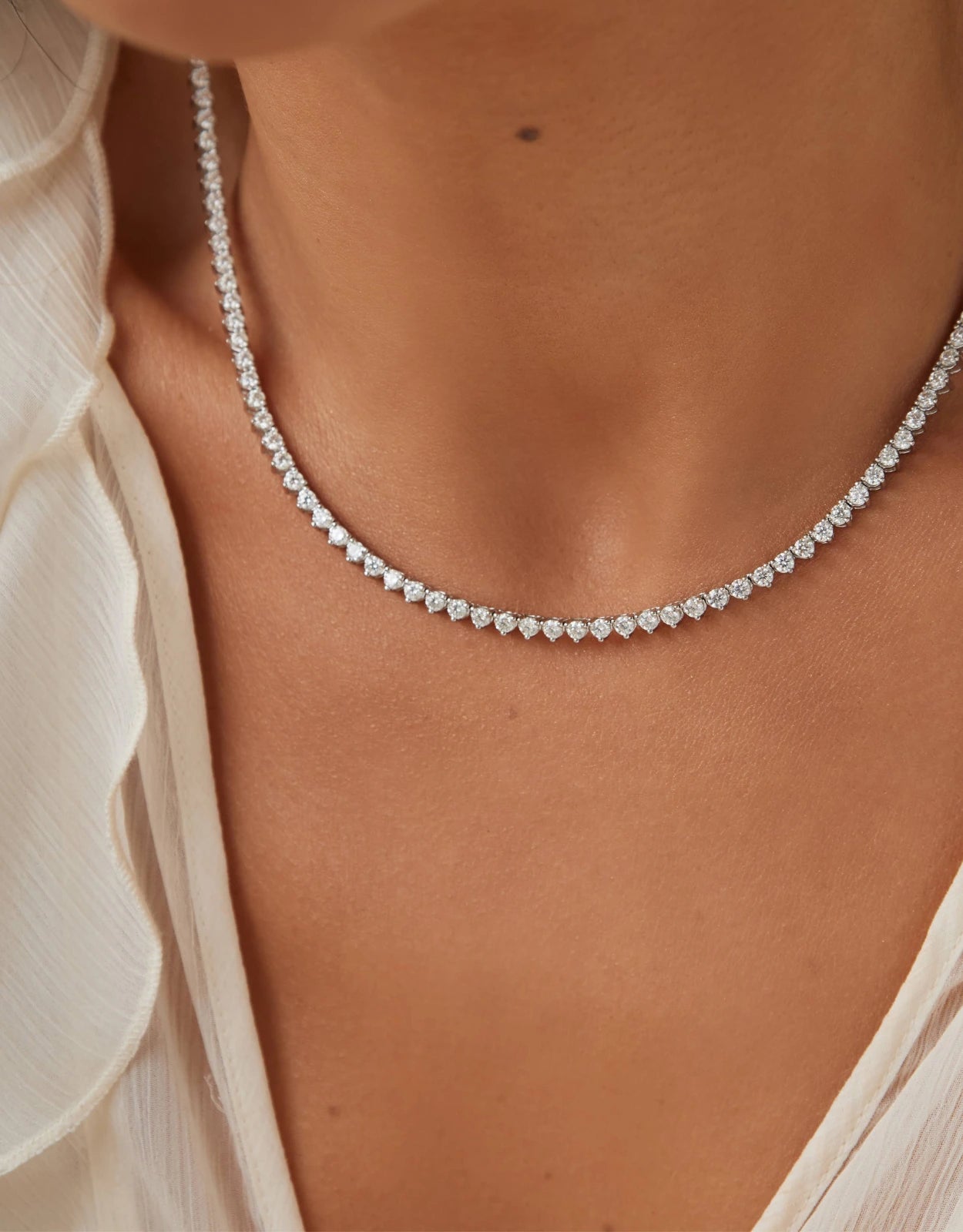 Moissanite necklace worn by an elegant woman