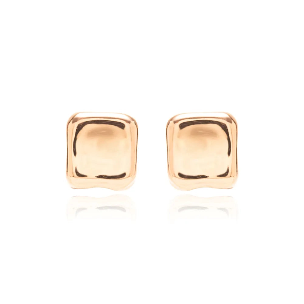 A pair of square stud earrings with a polished, rounded rectangular shape in a warm gold finish, set against a clean white background with a soft reflection below.